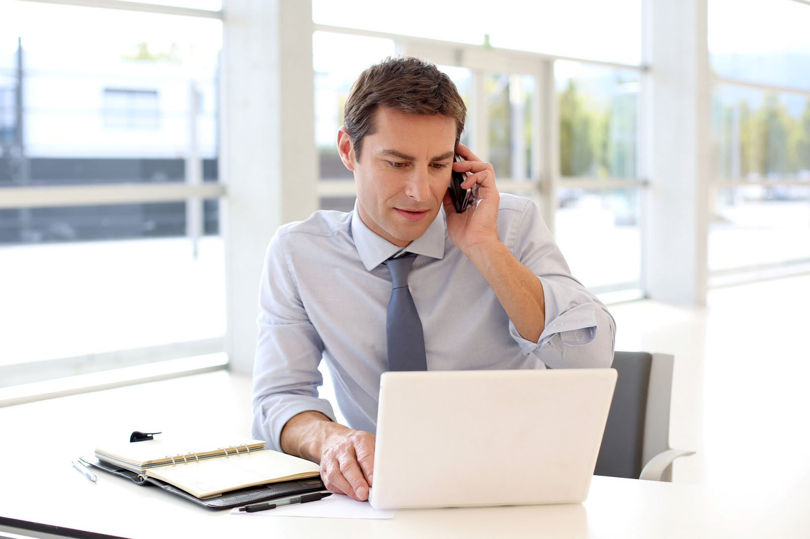 A member of a professional team answering a phone enquiry