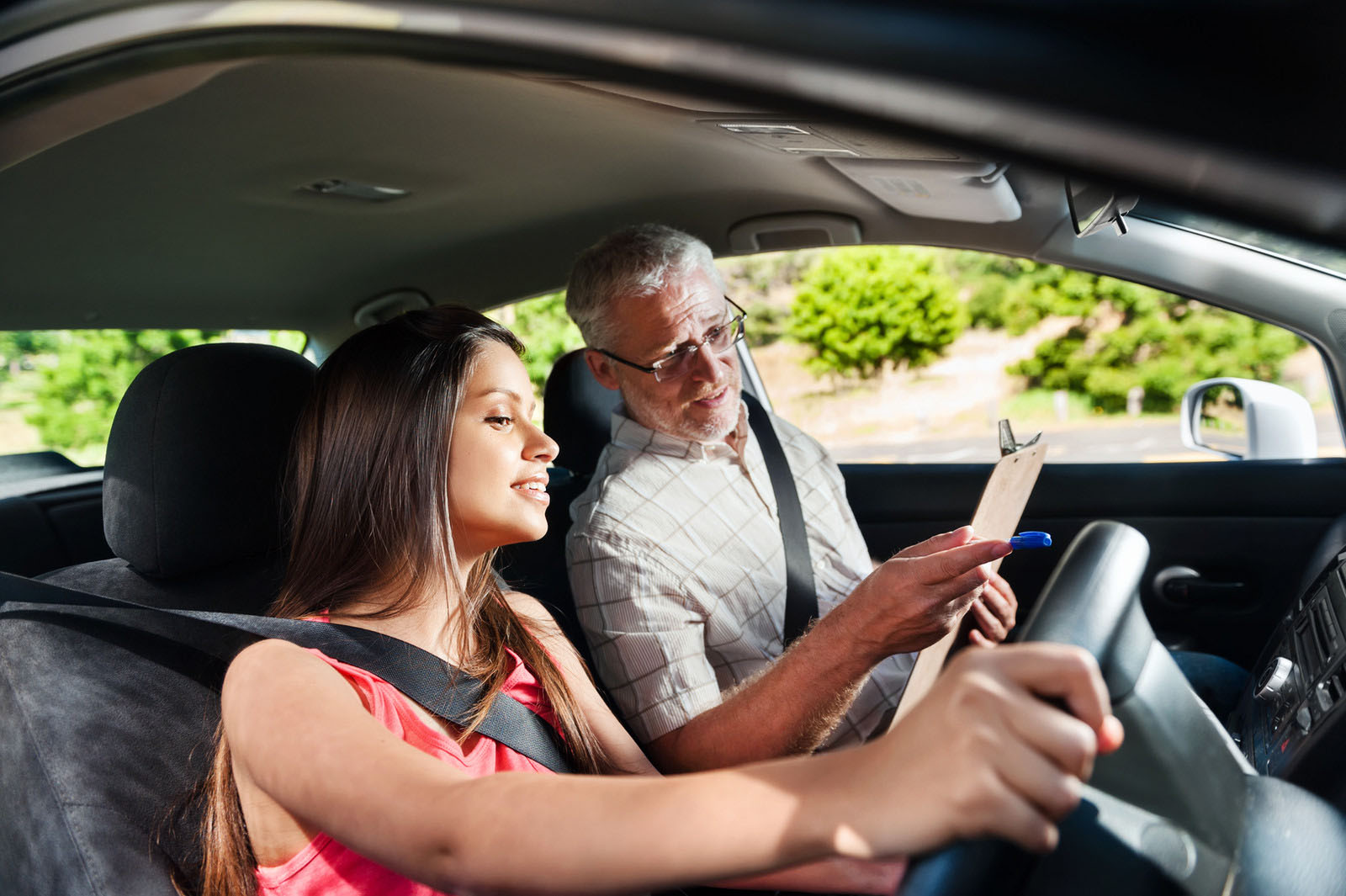 Learner driver receiving guidance from an instructor